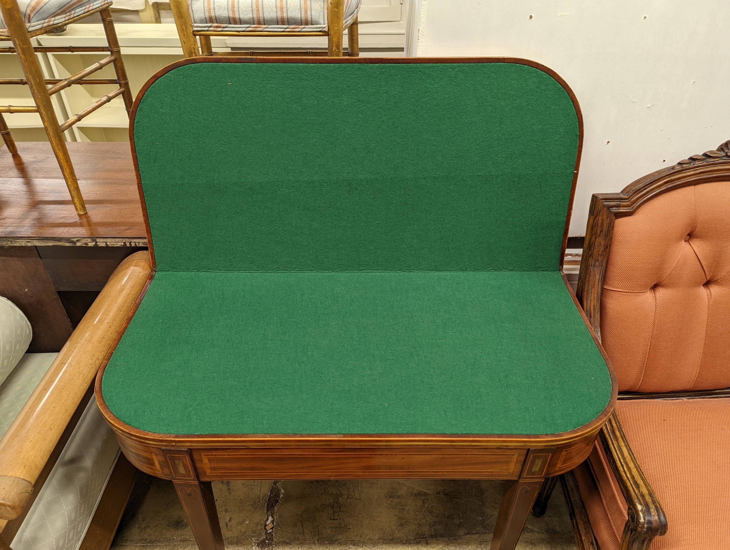 A Regency banded mahogany D shaped folding card table, width 90cm, depth 44cm, height 75cm